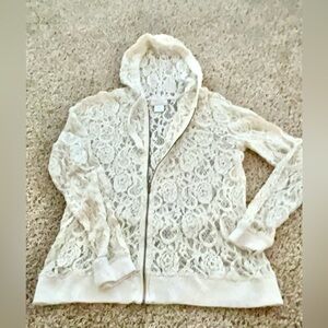 Nice crème colored lace, zip up hoodie size medium.